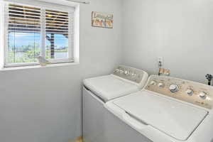 Laundry area featuring washing machine and clothes dryer
