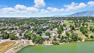 Aerial perspective of suburban area with a water and mountain view