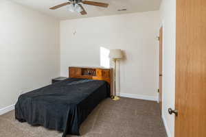 Bedroom featuring carpet and a ceiling fan