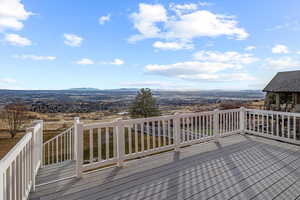 Wooden terrace featuring a mountain view