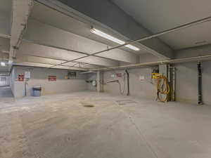 Garage featuring concrete block wall