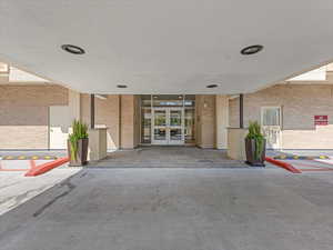Entrance to property with french doors and brick siding