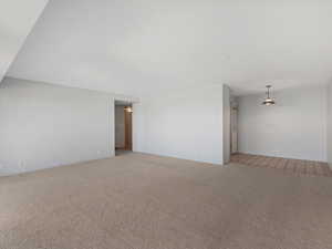 Unfurnished room with light colored carpet