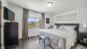 Bedroom featuring dark wood-style floors