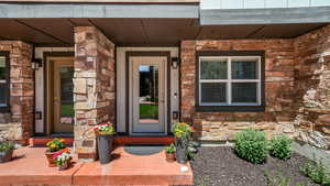 Property entrance with stone siding