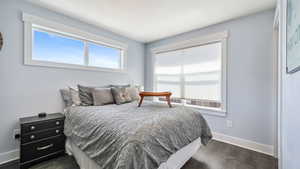 Bedroom featuring dark wood-type flooring