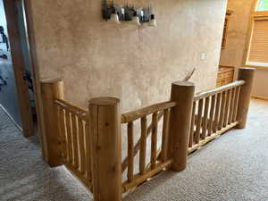 Stairway featuring carpet