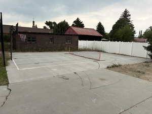 View of basketball court with a tennis court