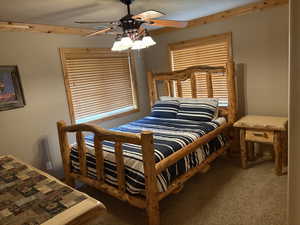 Bedroom featuring carpet flooring and a ceiling fan