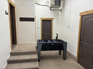 Playroom featuring carpet and a heating unit