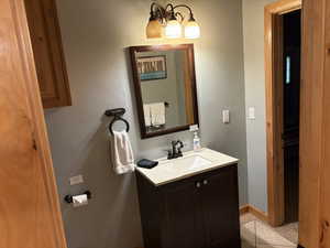Bathroom featuring vanity and tile patterned floors