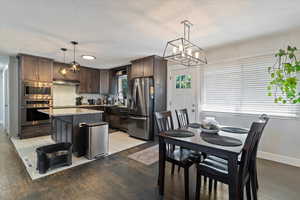 Dining room with a chandelier and light wood finished floors