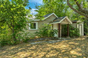 View of Second Unit front of property featuring a storage shed