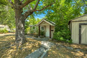 View of front Second Unit  of home with a shed