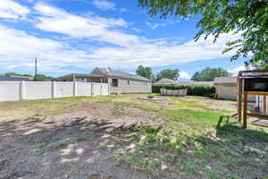 View of yard with a storage unit