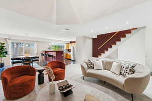 Living room with stairway and recessed lighting