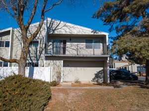 Back of property featuring a balcony