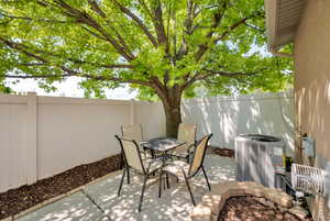 Fenced backyard featuring a patio and outdoor dining area