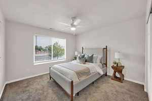 Bedroom featuring carpet and ceiling fan