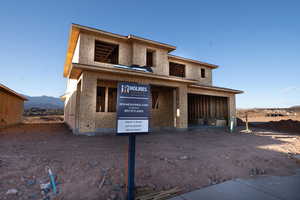 View of front of home featuring stucco siding