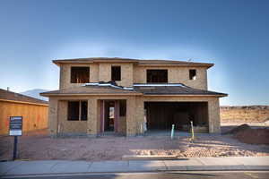Property under construction with covered porch and stucco siding