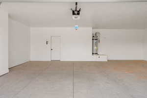 Garage with secured water heater and a garage door opener