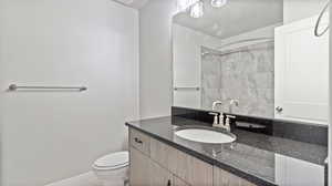 Bathroom with vanity and a shower