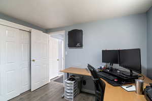 Office space with dark wood-style flooring