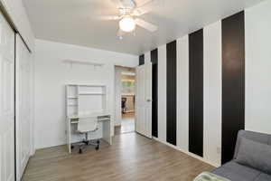 Office featuring light wood-style floors and ceiling fan