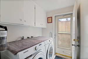 Laundry area with washing machine and dryer and cabinet space
