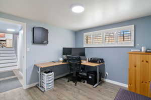 Office space with light wood-style floors