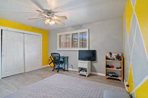 Office space featuring a ceiling fan and wood finished floors