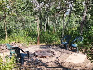 View of patio featuring a fire pit