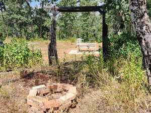 View of yard with a fire pit