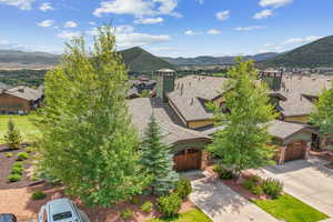 Aerial perspective of suburban area with a mountainous background