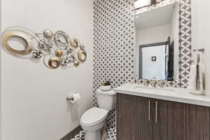 Bathroom featuring toilet and vanity