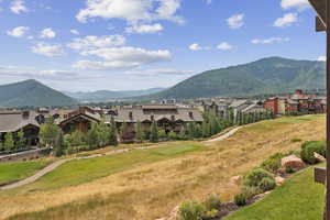 View of mountain backdrop featuring nearby suburban area
