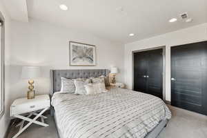 Bedroom with carpet floors and recessed lighting