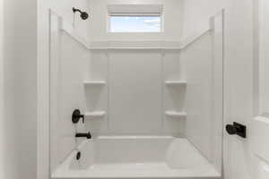 Full bathroom with tub / shower combination