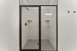 Full bath with a shower stall
