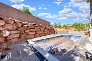 View of swimming pool featuring a fenced backyard