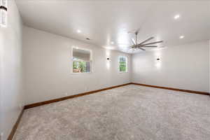 Unfurnished room with carpet, ceiling fan, and recessed lighting