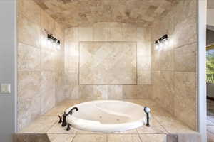 Full bathroom with a whirlpool tub