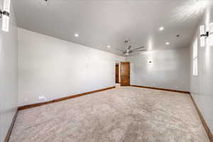 Carpeted empty room featuring recessed lighting and ceiling fan