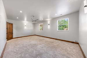Carpeted spare room featuring recessed lighting and ceiling fan