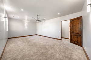 Carpeted empty room with recessed lighting and ceiling fan