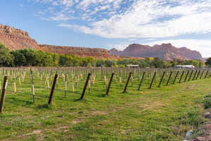 View of mountain backdrop featuring rural landscape
