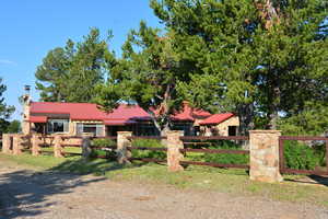Eastern elevation of Ranch House and fenced yard.