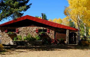 View of side of home featuring stone siding