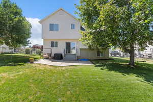 Rear view of house featuring a patio area and entry steps